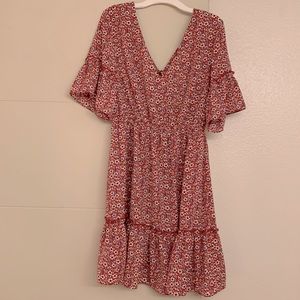 Open back mini dress with flounce sleeves and tie at neck